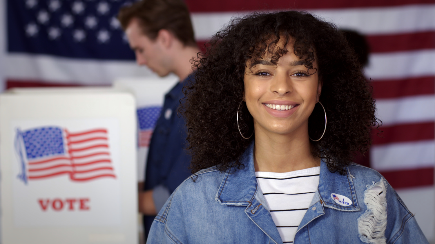 Young adult voter at the voting booth